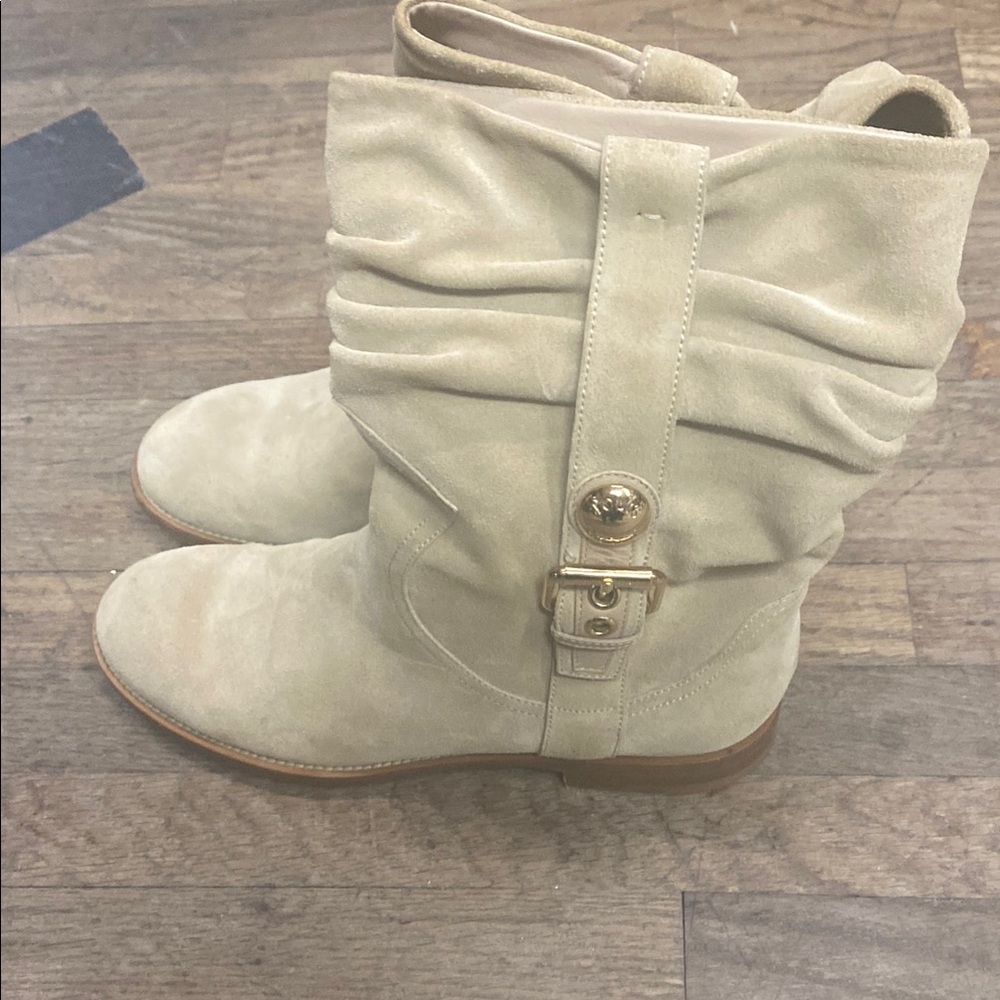 Looks like :Louis Vuitton Cream Ankle Boots